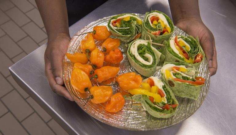 Plate of sandwiches and vegetables