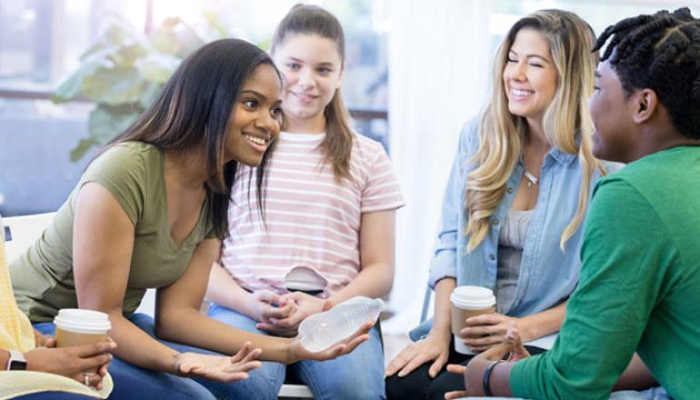 Young women discussing job opportunities
